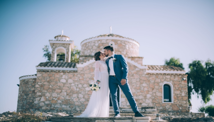 Married couple outside Greek church