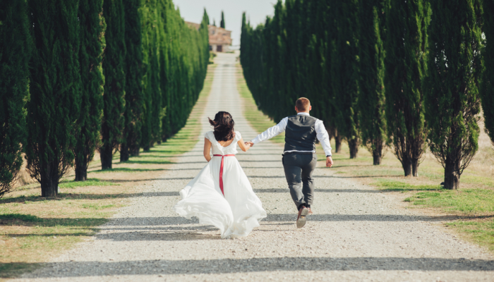 bride and groom walking through italy